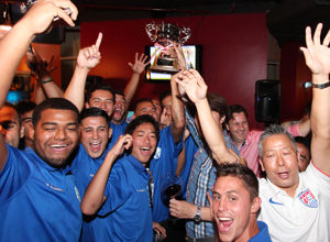 Members of the Matao, Guam men's national football team, proudly hoist the EAFF East Asian Cup Round 1 trophy, during the awards ceremony held at Samurai Restaurant Friday evening. Guam finished as the lone undefeated team in the tournament to advance to the semifinal round for the third-straight time.