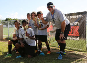 The Warriors pose with their U10 division championship trophies of the Guam Football Association 3v3 Grassroots Tournament at the GFA National Training Center. The Warriors defeated the Tiger Sharks 3-2 in the final.