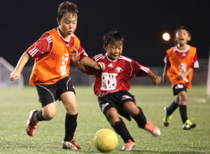 The Wings FC U8 second team's Kenny Farrell and the Wings FC U8 first team's Riku Meyar battle for possession of the ball during a semifinal match of the Guam Football Association U8 & U10 Youth Tournament at the GFA National Training Center Saturday. The Wings team went on to win the U8 championship.