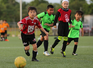 The Wings FC U8 second team's Aidan Jones races to gain possession of the ball during an early round match against the ASC Trust Islanders in the Guam Football Association U8 & U10 Youth Tournament at the GFA National Training Center Saturday. The Wings team went on to win the U8 championship.