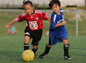 The Wings FC U8 first team's Luella Cramer gets set to race to the goal ahead of her Guam Shipyard Wolverines opponent in an early round match of the Guam Football Association U8 & U10 Youth Tournament at the GFA National Training Center Saturday.