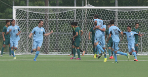 Members of the Northern Mariana Islands team celebrate after Nicolas Swaim (No. 2) equalized the match against Macau off a header in the first half. NMI's Kirk Schuler (No. 6) later scored the eventual game winner, securing the nation's first-ever international win - a 2-1 performance against Macau.