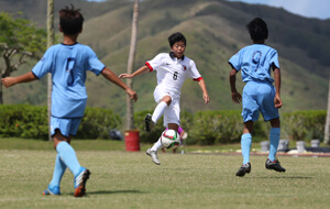 Hong Kong's Wong Hin Sum controls the ball before attempting a shot against the Northern Mariana Islands in a Day 2 match of the EAFF East Asian U13 2015 Festival held at LeoPalace Resort Guam Monday.