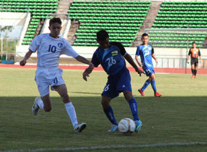Guam's Ethan Lamberton attempts to stop a pass by Brunei-Darussalam's Abdul Matin bin Norazlan in an opening match of the AFC U16 Championship Group H Qualifier in Vientiane, Laos. Brunei-Darussalam defeated Guam 4-1.