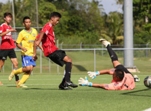 The Wings' Derek Okuhama rushes toward the goal ahead of a visiting Matansa defender from the Northern Mariana Islands in an opening day U18 division match of the Youth Invitational Gobblefest soccer tournament at the Guam Football Association National Training Center Friday. The Wings won 3-1.