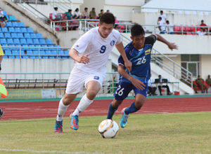 Guam's Michael "Jake" Benito powers past Brunei-Darussalam's Abdul Matin bin Norazlan in an opening match of the AFC U16 Championship Group H Qualifier in Vientiane, Laos. Brunei-Darussalam defeated Guam 4-1.