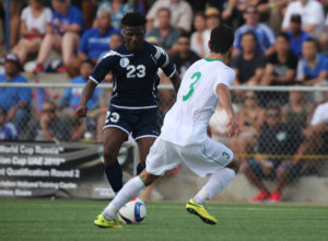 Guam's Shane Malcolm elects to change direction en route to the goal facing defensive pressure from Turkmenistan's Soyunov Shohrat during Guam's first-ever FIFA World Cup Qualifier match held in Guam Thursday afternoon at the Guam Football Association National Training Center. Guam defeated Turkmenistan 1-0.