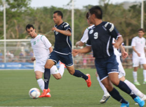 Guam's Shawn Nicklaw finds space and moves past Turkmenistan's Orazov Suleyman during Guam's first-ever FIFA World Cup Qualifier match held in Guam Thursday afternoon at the Guam Football Association National Training Center. Guam defeated Turkmenistan 1-0.